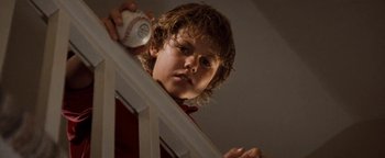 Movie still from “Free Willy” (1993), directed by Simon Wincer – A young boy holding a baseball in his hand; Close Up shot, Low angle
