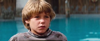 Movie still from “Free Willy” (1993), directed by Simon Wincer – A young boy is looking into the distance; Close Up shot, High angle