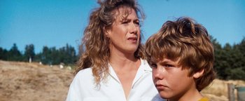 Movie still from “Free Willy” (1993), directed by Simon Wincer – A woman and a boy; Close Up shot, Over the shoulder angle