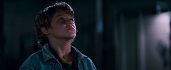 Movie still from “Free Willy” (1993), directed by Simon Wincer – A young man looking up at the sky; Close Up shot, Low angle