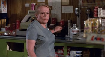 Movie still from “Friday the 13th” (1980), directed by Sean S. Cunningham – A woman standing in front of a counter in a store; Medium shot, Low angle