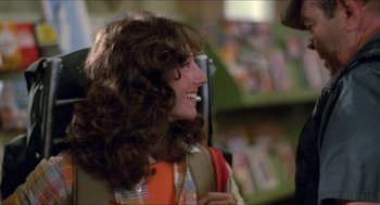 Movie still from “Friday the 13th” (1980), directed by Sean S. Cunningham – A woman with long brown curly hair is smiling; Close Up shot, Over the shoulder angle