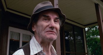 Movie still from “Friday the 13th” (1980), directed by Sean S. Cunningham – An older man wearing a hat and looking at the camera; Close Up shot, Low angle