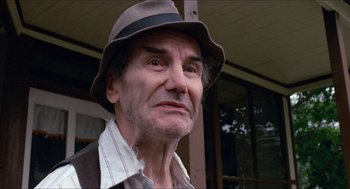 Movie still from “Friday the 13th” (1980), directed by Sean S. Cunningham – An older man wearing a hat and looking at the camera; Close Up shot, Low angle