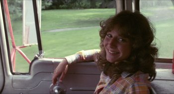 Movie still from “Friday the 13th” (1980), directed by Sean S. Cunningham – A woman sitting in the back seat of a car; Close Up shot, Over the shoulder angle