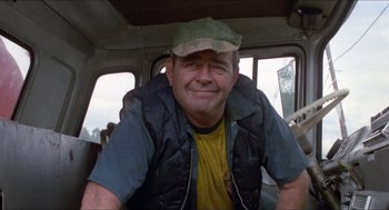 Movie still from “Friday the 13th” (1980), directed by Sean S. Cunningham – A person sitting in a vehicle; Medium shot, Low angle