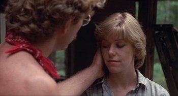 Movie still from “Friday the 13th” (1980), directed by Sean S. Cunningham – A woman touching the ear of another woman; Close Up shot, Over the shoulder angle