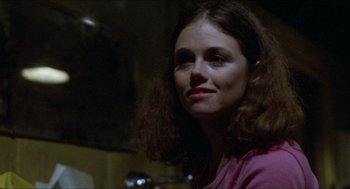 Movie still from “Friday the 13th” (1980), directed by Sean S. Cunningham – A person with long hair; Close Up shot, Over the shoulder angle