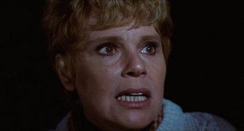 Movie still from “Friday the 13th” (1980), directed by Sean S. Cunningham – An older woman with blonde hair looking at the camera; Close Up shot, Low angle