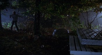 Movie still from “Friday the 13th” (1980), directed by Sean S. Cunningham – A bench in the middle of a forest at night; Wide shot, High angle