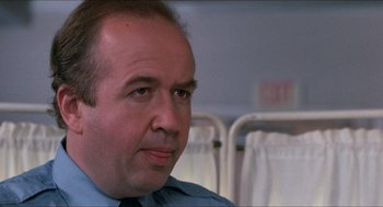 Movie still from “Friday the 13th” (1980), directed by Sean S. Cunningham – A person wearing a suit and tie; Close Up shot, Low angle