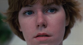 Movie still from “Friday the 13th” (1980), directed by Sean S. Cunningham – A woman's face with blue eyes; Extreme Close Up shot, Low angle