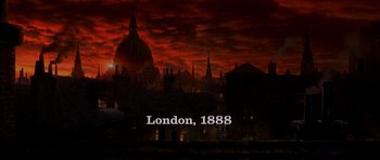 Movie still from “From Hell” (2001), directed by Allen Hughes – A city skyline with the words london , 1 8 8 8 written on it; Extreme Wide shot, High angle