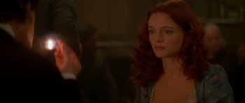 Movie still from “From Hell” (2001), directed by Allen Hughes – A beautiful young woman with long red hair and blue eyes; Close Up shot, Over the shoulder angle