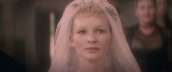 Movie still from “From Hell” (2001), directed by Allen Hughes – A person wearing a wedding veil; Close Up shot, Over the shoulder angle