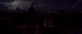 Movie still from “From Hell” (2001), directed by Allen Hughes – A dark city skyline at night with a lot of smoke coming out of the chimney; Extreme Wide shot, High angle