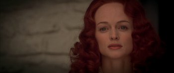 Movie still from “From Hell” (2001), directed by Allen Hughes – A person with long red hair; Close Up shot, Low angle