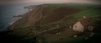 Movie still from “From Hell” (2001), directed by Allen Hughes – A group of people standing on top of a green hill; Extreme Wide shot, High angle