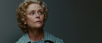 Movie still from “Frost/Nixon” (2008), directed by Ron Howard – An older woman looking up at the sky; Close Up shot, Low angle