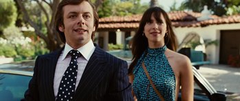 Movie still from “Frost/Nixon” (2008), directed by Ron Howard – A man and a woman standing next to each other in front of a building; Close Up shot, Low angle