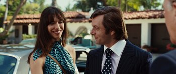Movie still from “Frost/Nixon” (2008), directed by Ron Howard – A man and a woman standing next to each other on the street; Close Up shot, Over the shoulder angle