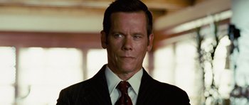 Movie still from “Frost/Nixon” (2008), directed by Ron Howard – A man in a suit and a tie; Close Up shot, Low angle