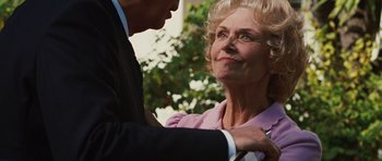 Movie still from “Frost/Nixon” (2008), directed by Ron Howard – An older woman and a younger man standing next to each other; Close Up shot, Low angle