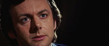 Movie still from “Frost/Nixon” (2008), directed by Ron Howard – A man's face with a blue eye; Close Up shot, Over the shoulder angle