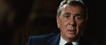 Movie still from “Frost/Nixon” (2008), directed by Ron Howard – An older man wearing a suit and tie; Close Up shot, Over the shoulder angle