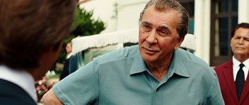 Movie still from “Frost/Nixon” (2008), directed by Ron Howard – An older man wearing a blue shirt looking to his left; Close Up shot, Over the shoulder angle