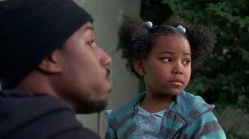 Movie still from “Fruitvale Station” (2013), directed by Ryan Coogler – A man and a little girl looking at each other; Close Up shot, Over the shoulder angle