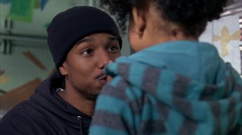 Movie still from “Fruitvale Station” (2013), directed by Ryan Coogler – A young man and a young woman looking into each others eyes; Close Up shot, Over the shoulder angle