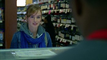 Movie still from “Fruitvale Station” (2013), directed by Ryan Coogler – A woman standing in front of a store counter; Close Up shot, Over the shoulder angle
