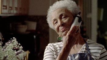 Movie still from “Fruitvale Station” (2013), directed by Ryan Coogler – An older woman talking on a cell phone; Close Up shot, Low angle