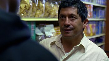 Movie still from “Fruitvale Station” (2013), directed by Ryan Coogler – A person sitting in a store; Close Up shot, Over the shoulder angle