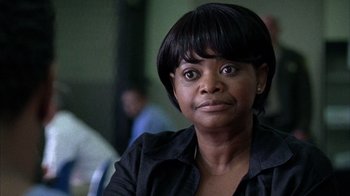 Movie still from “Fruitvale Station” (2013), directed by Ryan Coogler – A person wearing a black shirt; Close Up shot, Over the shoulder angle