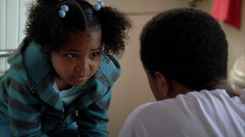 Movie still from “Fruitvale Station” (2013), directed by Ryan Coogler – A young girl and a young boy are facing each other; Close Up shot, Over the shoulder angle