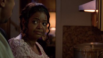 Movie still from “Fruitvale Station” (2013), directed by Ryan Coogler – An older woman with a surprised look on her face; Close Up shot, Over the shoulder angle