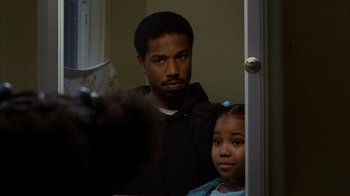 Movie still from “Fruitvale Station” (2013), directed by Ryan Coogler – A man and a young girl in front of a bathroom mirror; Close Up shot, Over the shoulder angle
