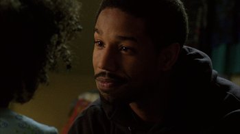 Movie still from “Fruitvale Station” (2013), directed by Ryan Coogler – A person looking at the camera; Close Up shot, Over the shoulder angle