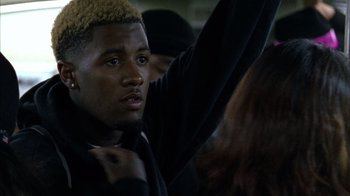 Movie still from “Fruitvale Station” (2013), directed by Ryan Coogler – A person wearing a black shirt; Close Up shot, Over the shoulder angle