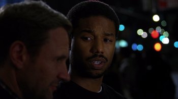 Movie still from “Fruitvale Station” (2013), directed by Ryan Coogler – Two men standing next to each other at night; Close Up shot, Over the shoulder angle
