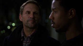 Movie still from “Fruitvale Station” (2013), directed by Ryan Coogler – A man and a man talking to each other; Close Up shot, Over the shoulder angle