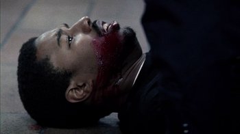 Movie still from “Fruitvale Station” (2013), directed by Ryan Coogler – A man laying on the ground with blood on his face; Close Up shot, Overhead angle