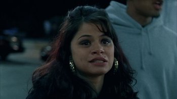Movie still from “Fruitvale Station” (2013), directed by Ryan Coogler – A person with long black hair; Close Up shot, Over the shoulder angle
