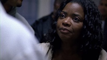 Movie still from “Fruitvale Station” (2013), directed by Ryan Coogler – A person looking at the camera; Close Up shot, Over the shoulder angle