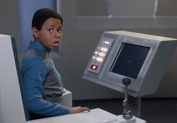 Movie still from “Galaxy Quest” (1999), directed by Dean Parisot – A young boy sitting in front of a computer monitor; Close Up shot, Over the shoulder angle