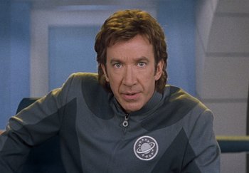 Movie still from “Galaxy Quest” (1999), directed by Dean Parisot – A person wearing a space suit; Close Up shot, Over the shoulder angle