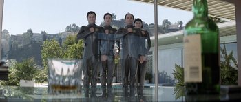 Movie still from “Galaxy Quest” (1999), directed by Dean Parisot – Four mannequins are standing in front of a building; Medium shot, Low angle