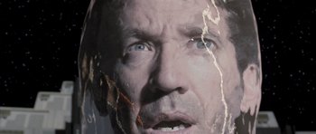 Movie still from “Galaxy Quest” (1999), directed by Dean Parisot – A man's face in a painting; Extreme Close Up shot, Overhead angle